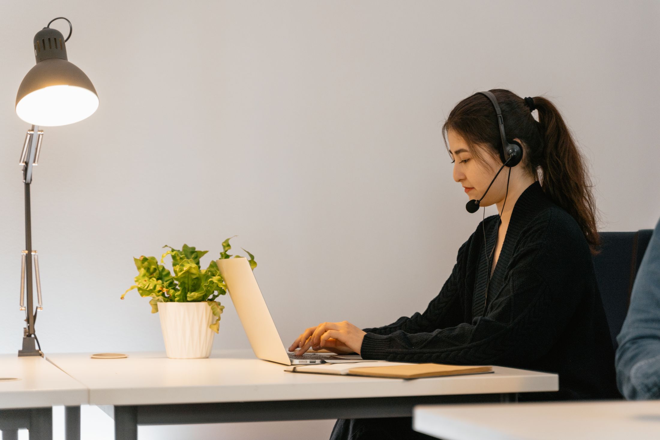 A coordinator on a headset working through the clinic's queue